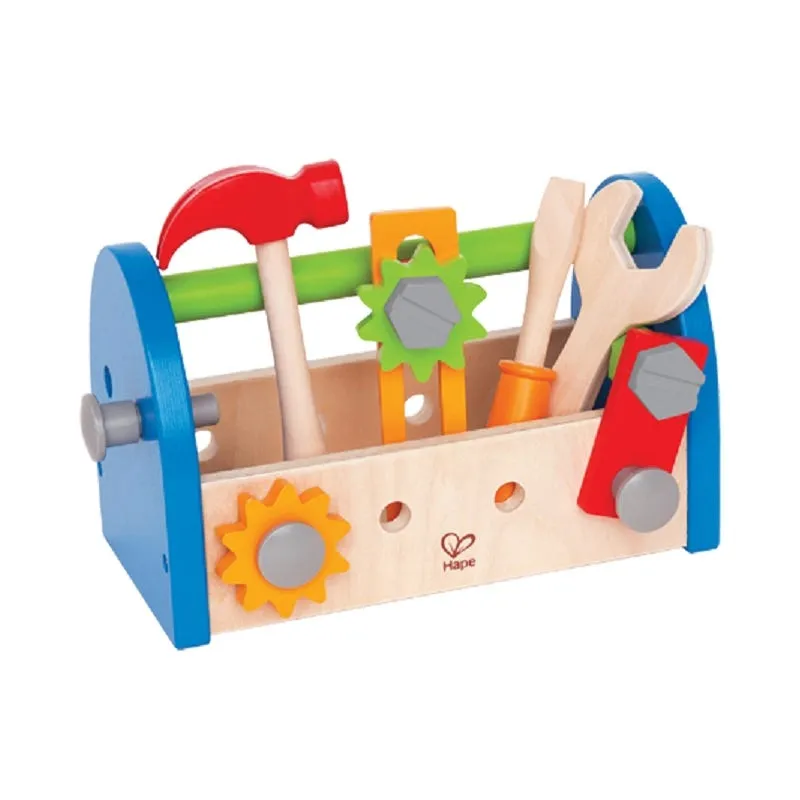 Child's wooden toy toolbox holding a hammer, wrench, saw and gears, standing in for a project's agreed tooling